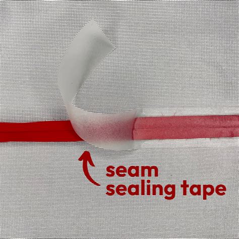 Close-up of seam sealing tape being applied to a fabric seam.