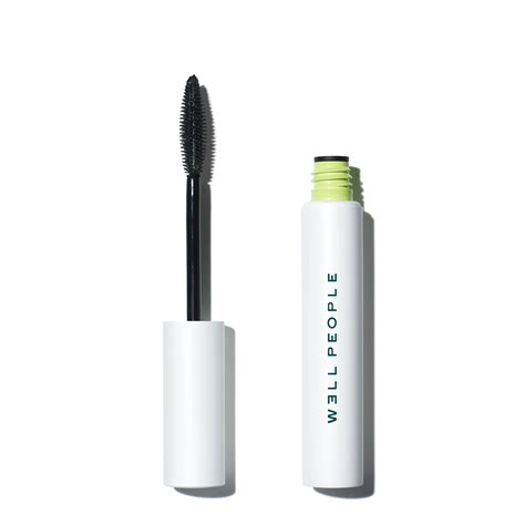 Close-up of the Well People Expressionist Pro Mascara wand and applied lashes
