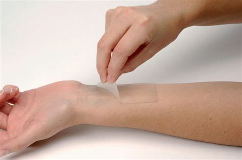 Diagram illustrating the gentle adhesion properties of silicone-based medical adhesives, highlighting minimal skin trauma upon removal.