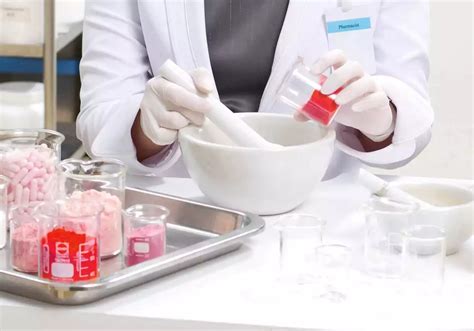 image of a pharmacist compounding a topical medication in a laboratory setting