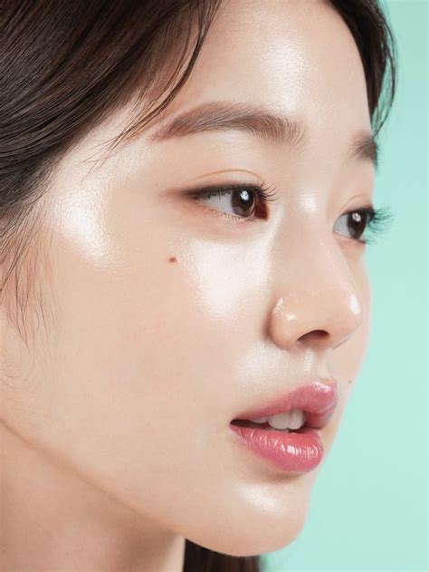 A woman with clear, dewy skin, showcasing the 'glass skin' effect