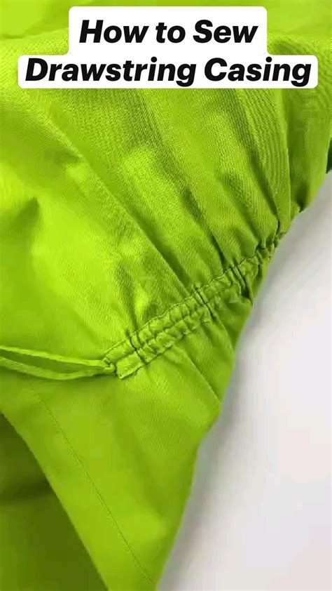 Close-up of the drawstring casing and threading process.