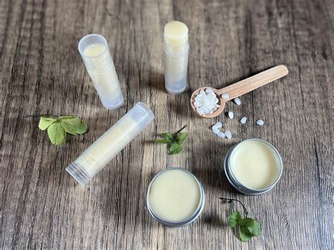 A comparison chart highlighting the minimal, natural ingredients in a homemade lip balm versus the lengthy, complex ingredient list of a popular commercial lip balm.