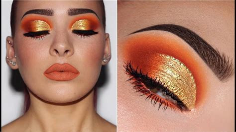 A makeup artist applying shimmering burnt orange eyeshadow to the eyelid.
