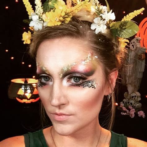 Ethereal woodland fairy makeup with autumnal hues and floral accents.
