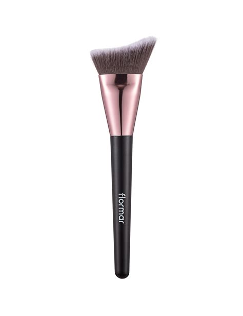 A contour brush defining the cheekbones with a soft shadow effect.