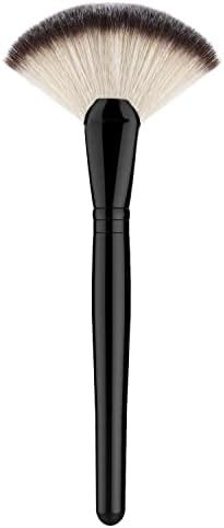 A fan brush delicately applying highlighter to the cheekbones.