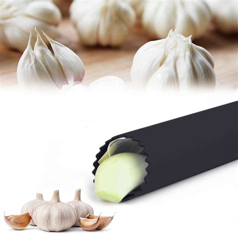 Close-up of a silicone garlic peeler tube with garlic cloves inside