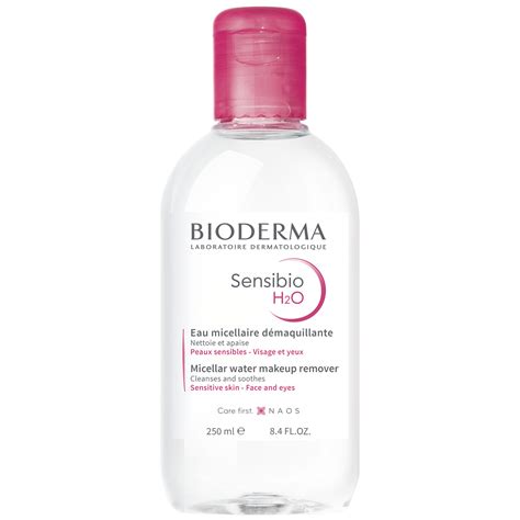 Close-up photo of a bottle of Bioderma Sensibio H2O with a cotton pad, emphasizing its gentle application.