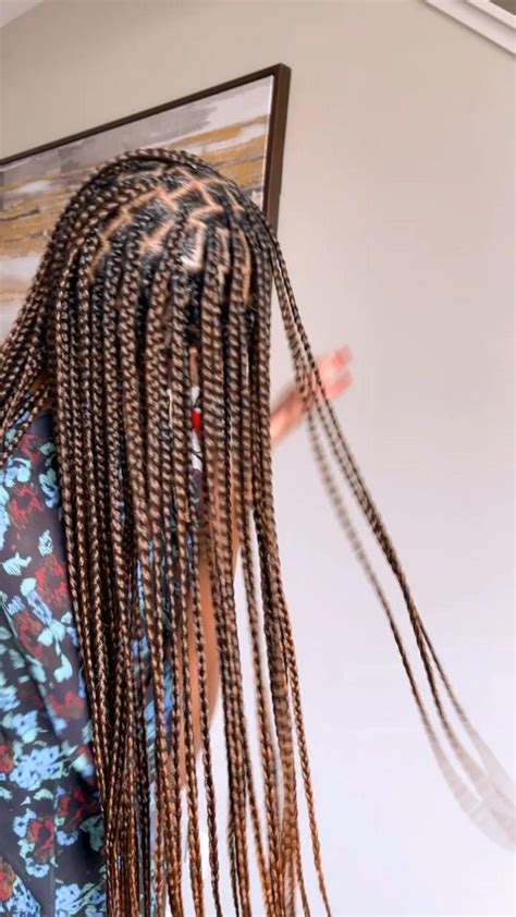 Side profile of long, ombré box braids