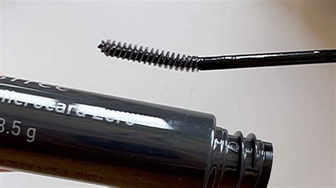 Close-up of CoverGirl Flourish mascara wand and separated lashes