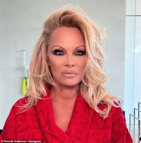 Pamela Anderson attending a public event with a natural makeup look.