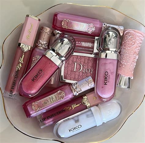 A selection of copper-toned lip glosses in various packaging styles.