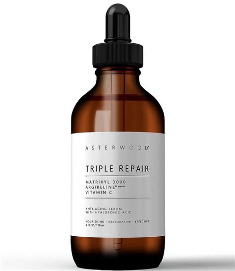 A close-up shot of the Asterwood Triple Repair Anti-Aging Face Serum bottle, showcasing its packaging and texture.