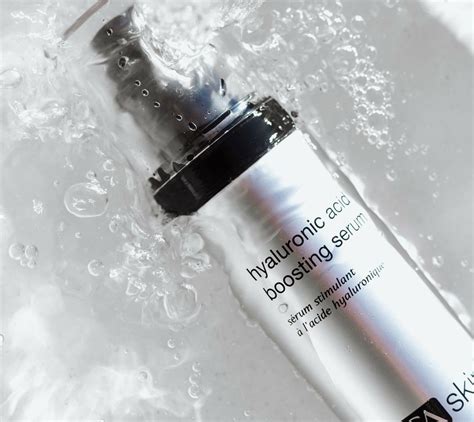 Illustration showing the dual-action hydration mechanism of the PCA SKIN Hyaluronic Acid Boosting Serum, highlighting both external moisture delivery and internal HA production stimulation.