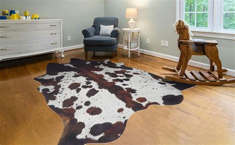 A visually appealing cowhide rug placed in a modern living room setting.