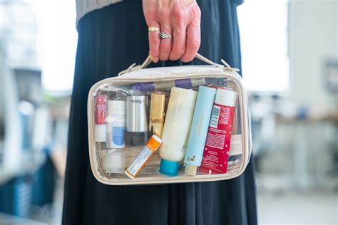 Away Clear Toiletry Bag showcasing its dual compartments and adjustable handle