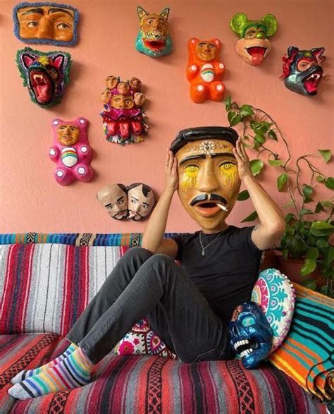A collection of vibrant, contemporary papier-mâché masks created by Joel Hernandez.