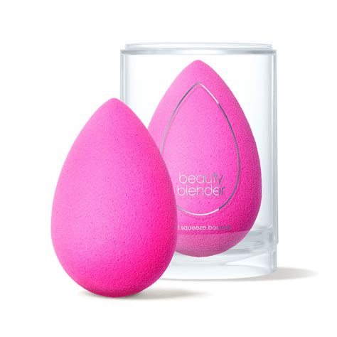 A beauty blender being used to apply foundation