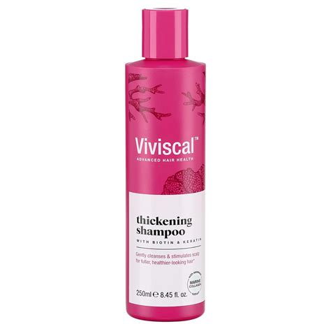A bottle of Viviscal Thickening Shampoo with ingredients like biotin highlighted.
