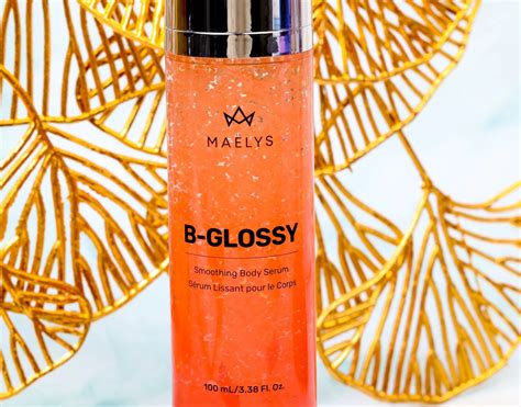 Close-up of the MAËLYS B-Glossy Smoothing Body Serum texture with visible pink bursting balls