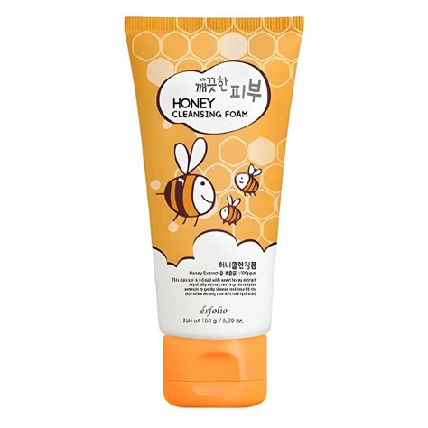 A close-up of rich, creamy foam from a bottle of honey cleansing foam.