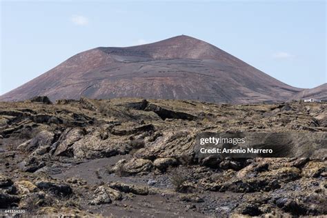 Cinematic shot of the volcanic landscape of Lanzarote, highlighting the harsh and beautiful filming location.