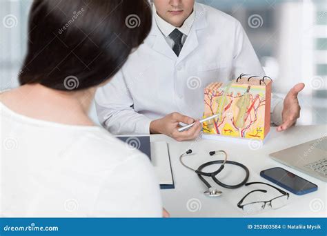Dermatologist consulting with a patient