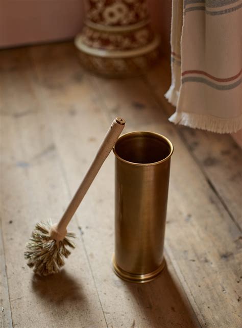 Elegant antique brass makeup brush holder with intricate detailing