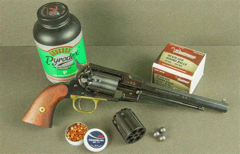 Image of a clean and oiled black powder revolver with cleaning tools