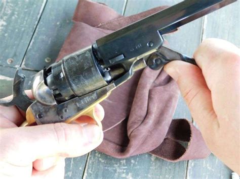 Step-by-step visual guide to loading a cap-and-ball revolver cylinder