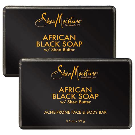 Side-by-side comparison of traditional African black soap bar and Shea Moisture bar