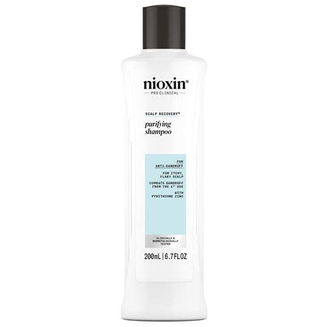 A close-up shot of Nioxin Scalp Recovery Purifying Shampoo bottle, highlighting its packaging and branding.