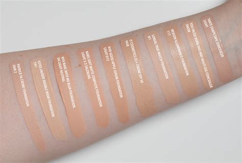 Swatches of the KVD Beauty Good Apple foundation shades on different skin tones.