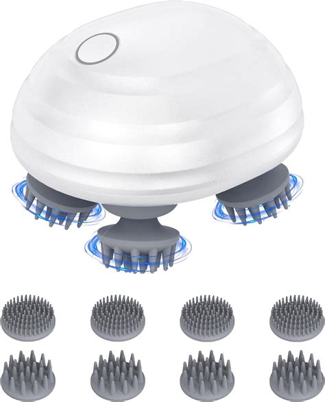 A variety of scalp massagers, including silicone brushes, handheld devices with nubs, and electric massagers, displayed against a clean background.
