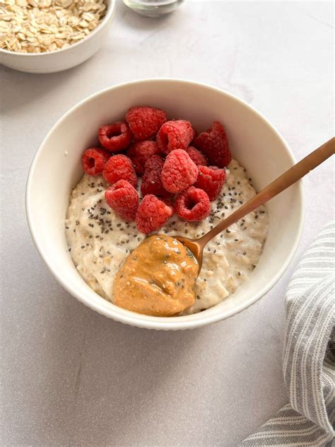 Close-up shot of ground oatmeal being mixed with honey and yogurt.