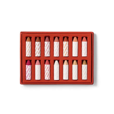 A selection of colorful balmie crayons in eco-friendly packaging.