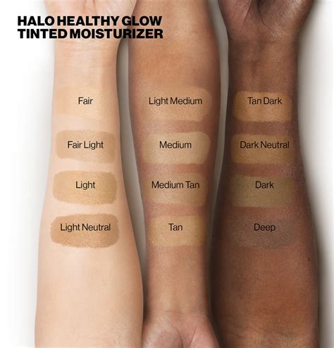 Swatches of different shades of the Smashbox Halo Healthy Glow Tinted Moisturizer on various skin tones.